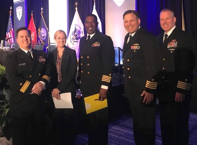 IMAGE: Naval Surface Warfare Center (NSWC) Commander, Rear Admiral Tom Druggan; NSWC Chief Technology Officer, Dr. Megan Fillinich (SSTM); NSWC Dahlgren Division Commanding Officer, Capt. Gus Weekes; NSWC Carderock Division Commanding Officer, Capt. Mark Vandroff; and  NSWC Chief Engineering Officer, Capt. Steven Murray, discuss how the NAVSEA Warfare Centers are "Integrating to Win" at the 30th annual Surface Navy Association symposium, Jan. 10. The "Integrating to Win" panel discussion featured enabling technologies such as electric drive, distribution and modularity and today's electromagnetic warfare technologies.