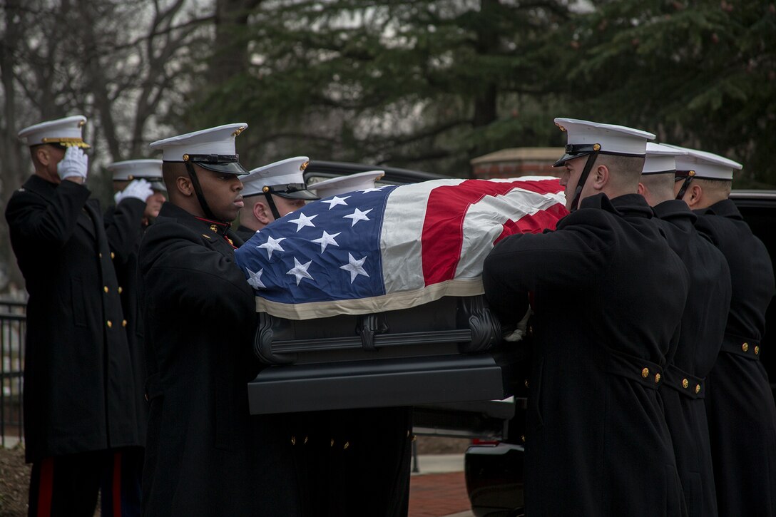 Marine Corps Body Bearers, Bravo Company, Marine Barracks Washington D.C., prepare to carry Maj. Gen. Paul A. Fratarangelo to his final resting place during a full honors funeral at Arlington National Cemetery, Arlington, Va., Jan. 16, 2018.  Marine Barracks Washington is home to the Marines who provide support for all Marine Corps funerals and many high-ranking government officials’ funerals within the National Capital Region. (Official U.S. Marine Corps photo by Cpl. Robert Knapp/Released)
