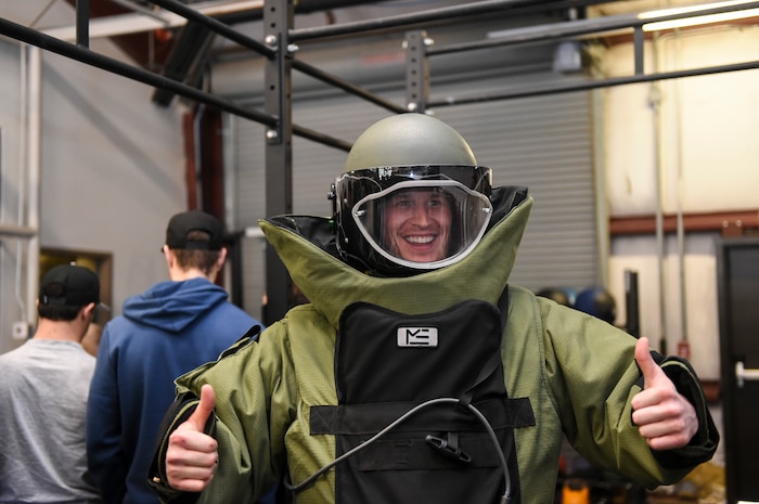 Adam Carlson, South Carolina Stingrays goalie, tries on a 628th Civil Engineer Squadron explosive ordnance disposal flight bomb suit at the EOD building here, Jan. 10, 2018.