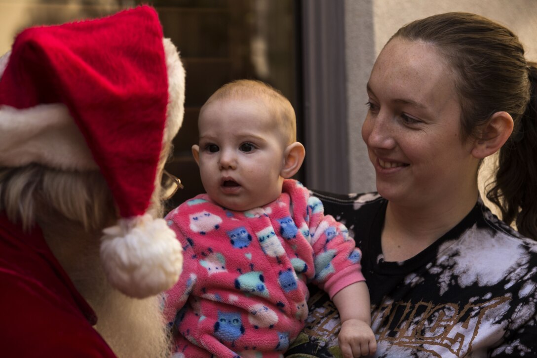 Service  members, Department of Defense employee,s and their families attend the Headquarters and Headquarters Squadron Christmas party at the sonoran pueblo on Marine Corps Air Station Yuma Ariz., Dec. 9, 2017. The christmas party was held for the families and services members to enjoy games arts and crafts and spend time together as one big family. (U.S. Marine Corps Photo by Cpl. Christian Cachola)