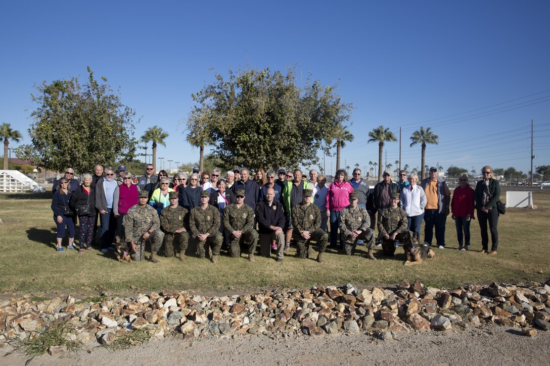 Guests participating in the Marine Corps Air Station (MCAS) Yuma Winter Tours observe the capabilities of the station, a demonstration of the K-9 unit, and an obstacle course demonstration at various locations on MCAS Yuma, Ariz., Dec. 12, 2017. The Winter Tours have not been conducted for the past two years, but have been resumed by Col. David A. Suggs, the station commanding officer, to build a better relationship with the community. (U.S. Marine Corps photo taken by Cpl. Ernest Grant)