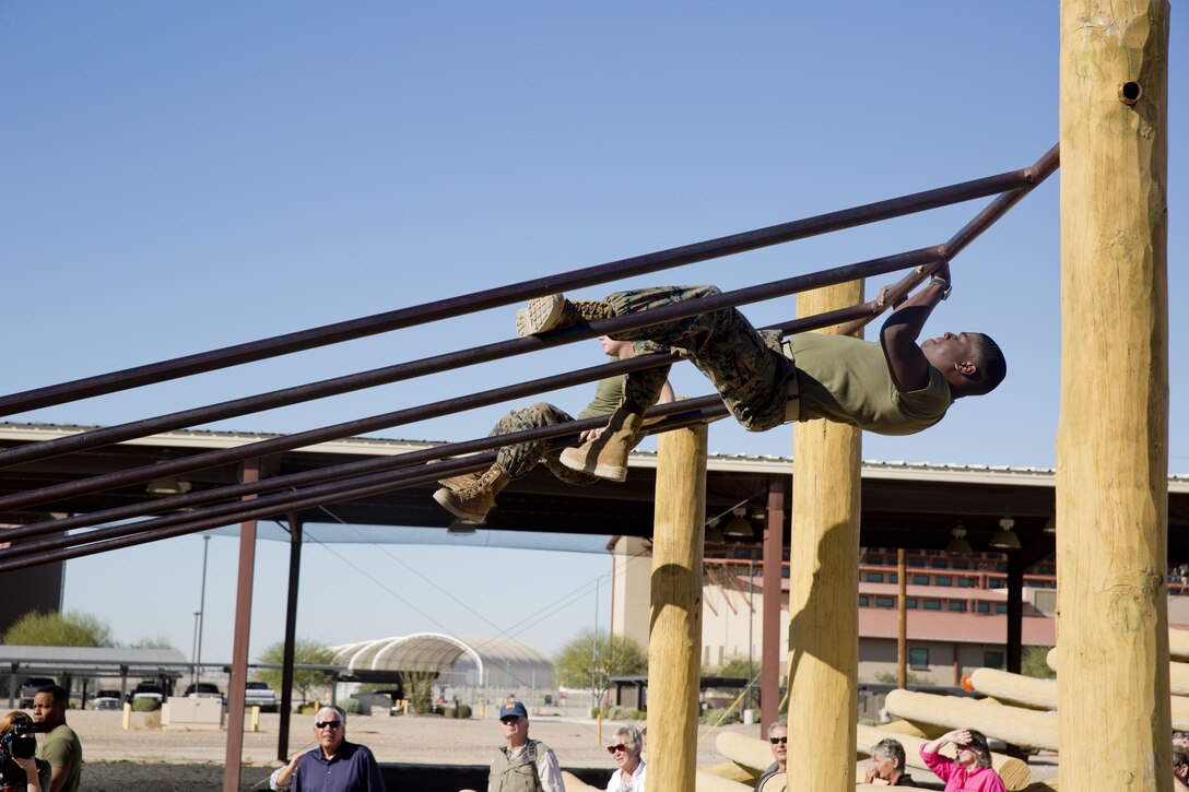 Guests participating in the Marine Corps Air Station (MCAS) Yuma Winter Tours observe the capabilities of the station, a demonstration of the K-9 unit, and an obstacle course demonstration at various locations on MCAS Yuma, Ariz., Dec. 12, 2017. The Winter Tours have not been conducted for the past two years, but have been resumed by Col. David A. Suggs, the station commanding officer, to build a better relationship with the community. (U.S. Marine Corps photo taken by Cpl. Ernest Grant)
