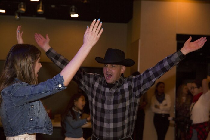 Dads, daughters saddle up to dance night away