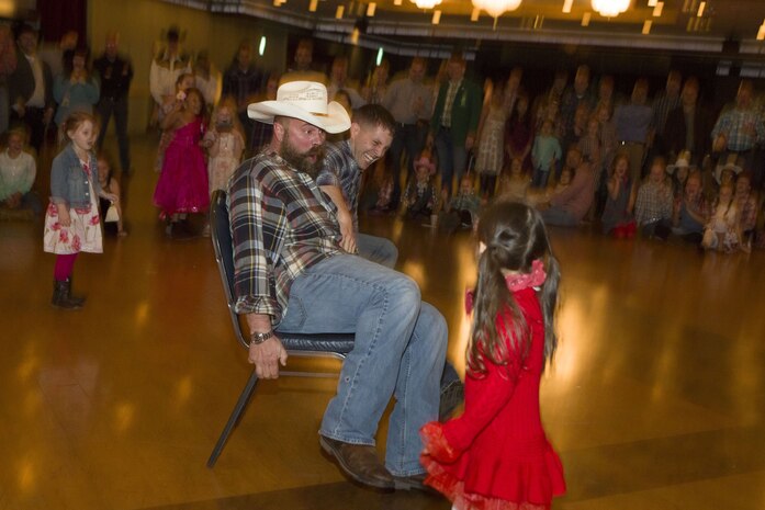 Dads, daughters saddle up to dance night away