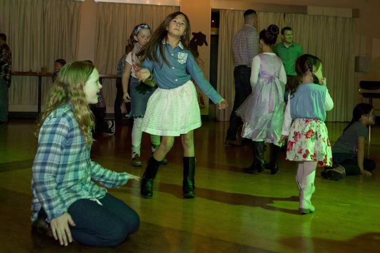 Dads, daughters saddle up to dance night away