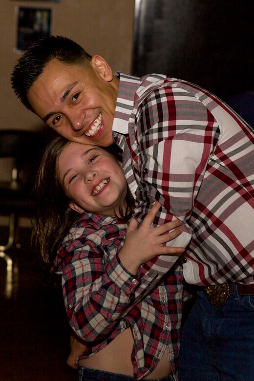 Dads, daughters saddle up to dance night away
