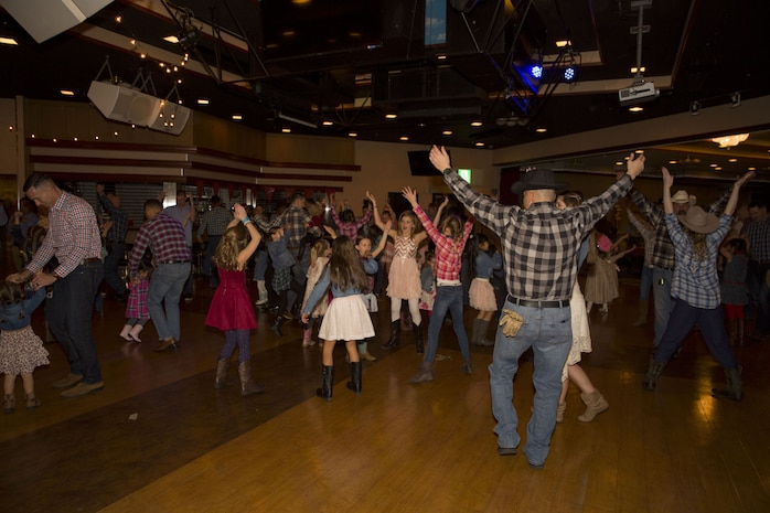 Dads, daughters saddle up to dance night away