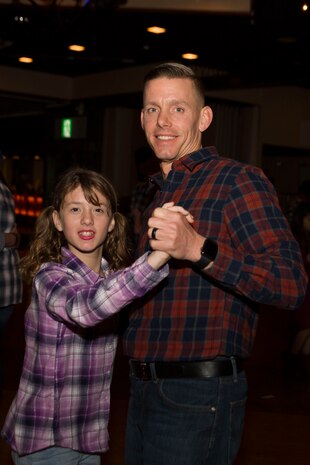 Dads, daughters saddle up to dance night away