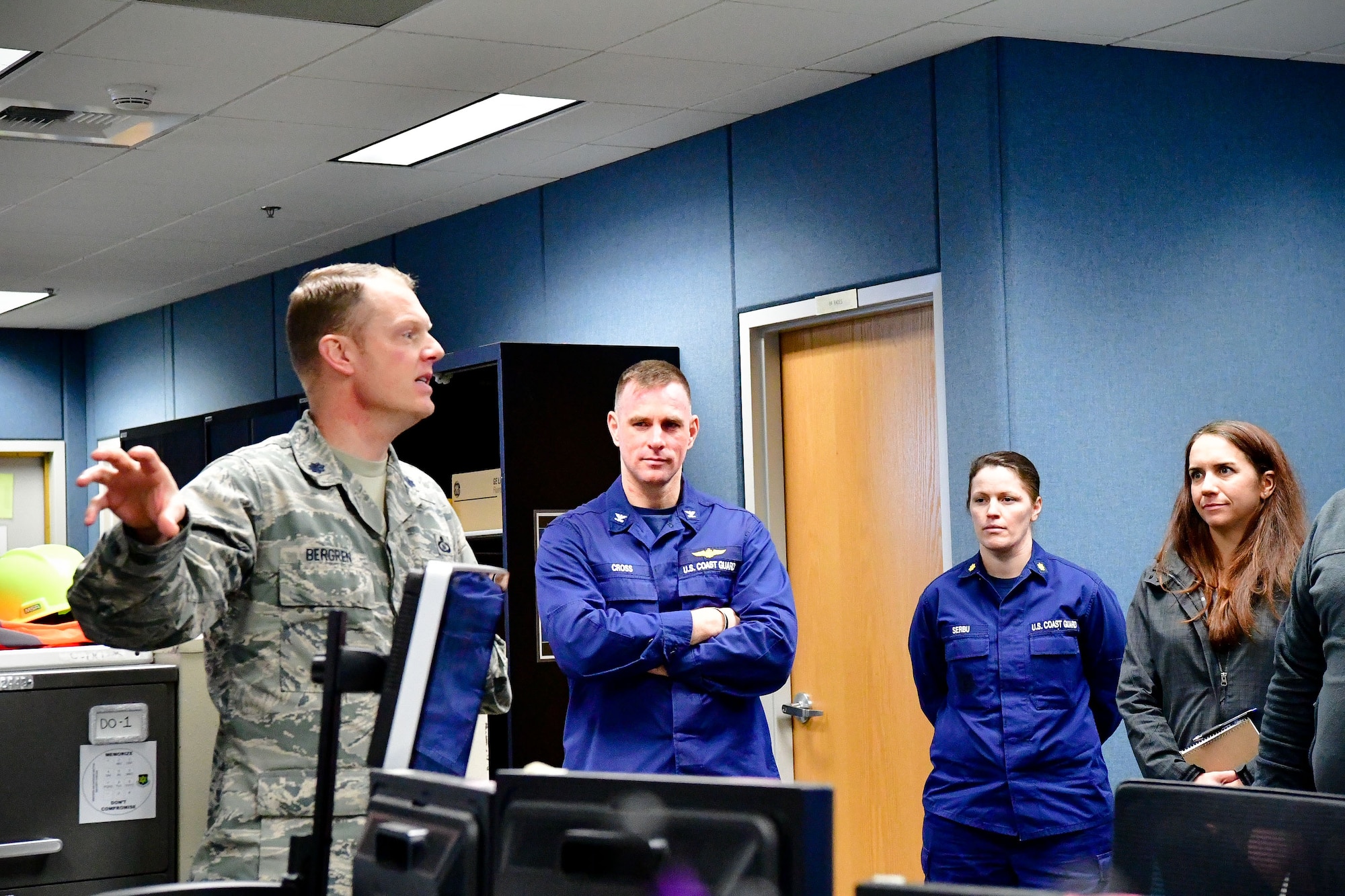 Lt. Col. Brian Bergren, 225th Air Defense Squadron director of operations, discusses lessons learned from Hurricane Harvey recovery efforts with Capt. Sean Cross, U.S. Coast Guard 13th District chief of incident management, and Lt. Cmdr. Brook Serbu, U.S. Coast Guard 13th District command center chief.