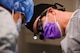 Lt. Col. Curt Hayes, 90th Medical Group oral surgeon, works with his assistant to suture the wounds left behind after a tooth removal surgery at F.E. Warren Air Force Base, Wyo., Jan. 16, 2018. The sutures aid in wound healing and help minimize bleeding. The patient is prescribed Tylenol and it reduces the recovery time by several days allowing Airmen to return to the field and focus on the mission sooner. (U.S. Air Force photo by Airman 1st Class Abbigayle Wagner)