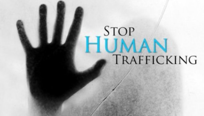 Graphic with a hand and the language Stop Human Trafficking.