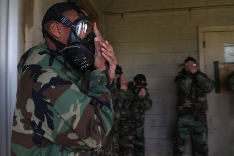 MCAS FUTENMA, OKINAWA, Japan – Marines clear their gas masks Jan. 11 in the gas chamber on Marine Corps Air Station Futenma, Okinawa, Japan.