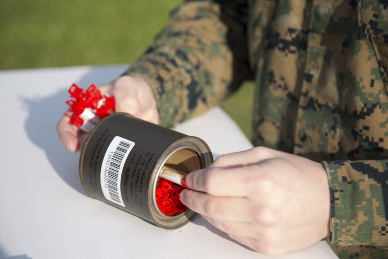 MCAS FUTENMA, OKINAWA, Japan – Capsules of 2-chlorobenzalmalononitrile, or CS gas, are counted before Marines go into the gas chamber Jan. 11 on Marine Corps Air Station Futenma, Okinawa, Japan.