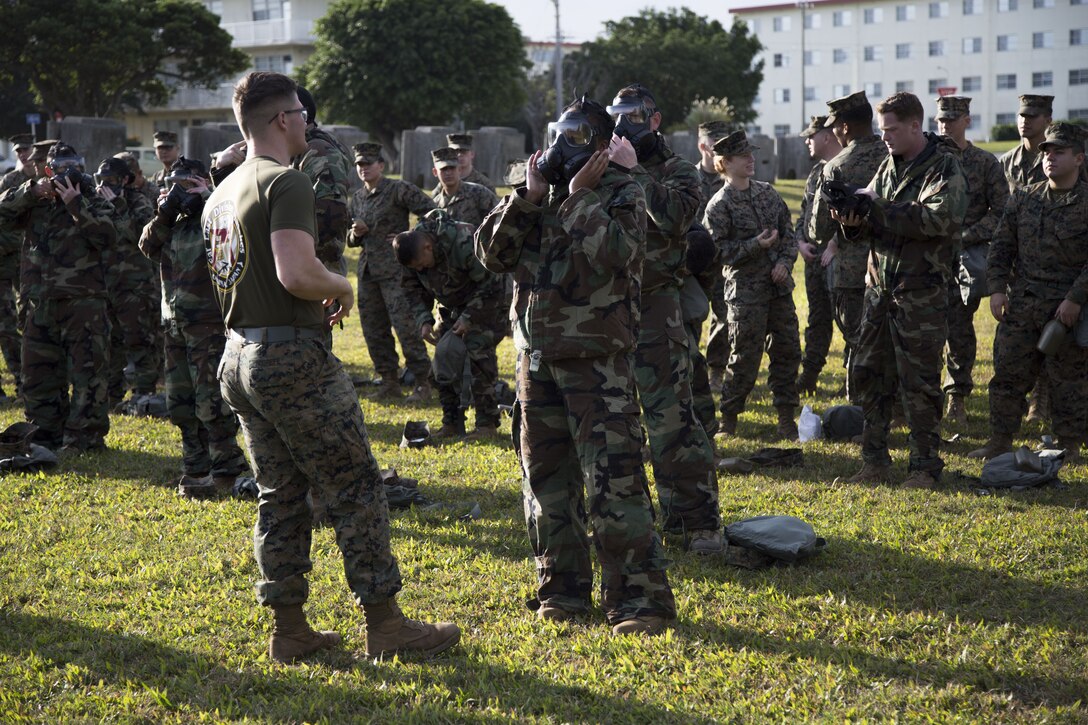 MCAS FUTENMA, OKINAWA, Japan – Marines suit up with mission oriented protective posture gear Jan. 11 at the gas chamber on Marine Corps Air Station Futenma, Okinawa, Japan.