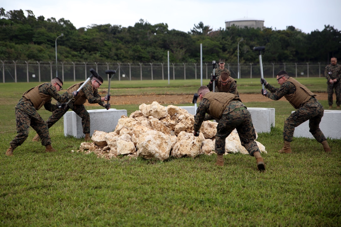 Brig Marines simulate hard labor during a Correctional Custody Unit demonstration Jan. 12 in the Brig aboard Camp Hansen, Okinawa, Japan.