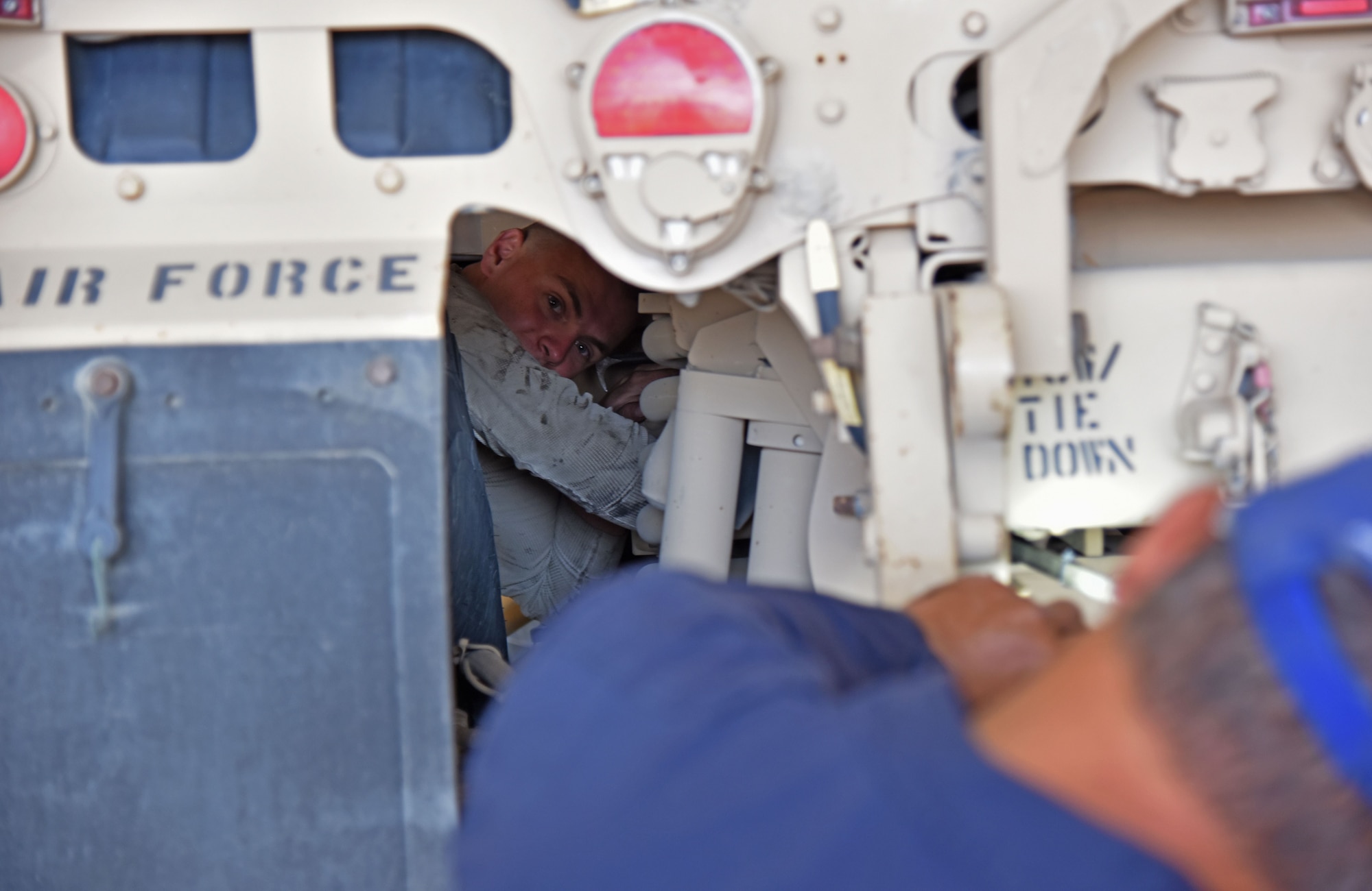 U.S. Air Force Staff Sgt. Nicholas Dayak, 407th Expeditionary Logistics Readiness Squadron Vehicle Management Special Purpose Maintenance NCO in charge, works on a mine-resistant ambush-protected vehicle at the 407th Air Expeditionary Group in Southwest Asia, Dec. 18, 2017. Dayak and the rest of vehicle management ensure that all government owned vehicles are properly maintained. (U.S. Air Force photo by Staff Sgt. Joshua Edwards/Released)