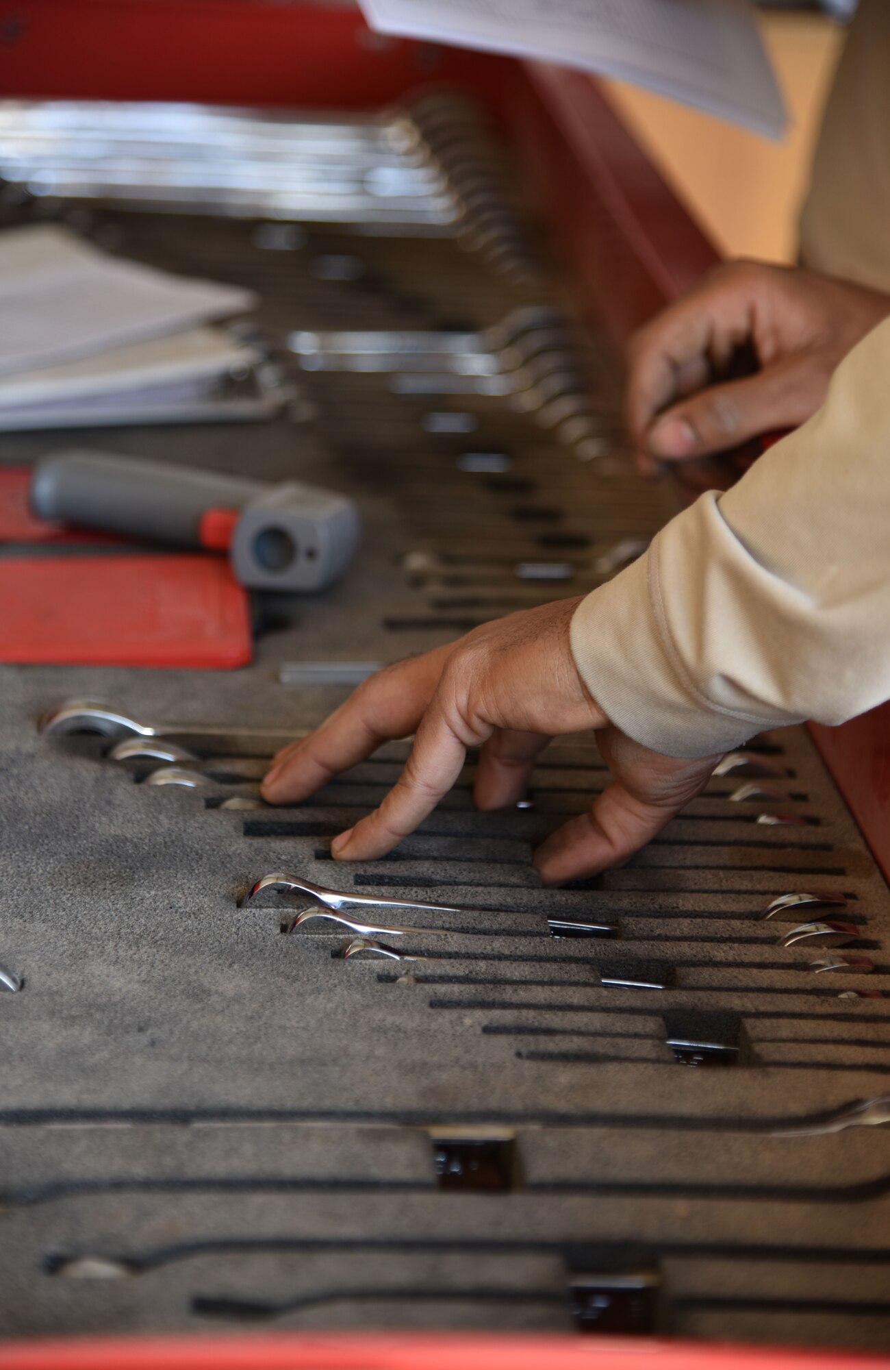 A 407th Expeditionary Logistics Readiness Squadron Vehicle Management Airman inspects tools at the 407th Air Expeditionary Group in Southwest Asia, Dec. 18, 2017. Vehicle management routinely checks their tools to ensure accountability of all items. (U.S. Air Force photo by Staff Sgt. Joshua Edwards/Released)