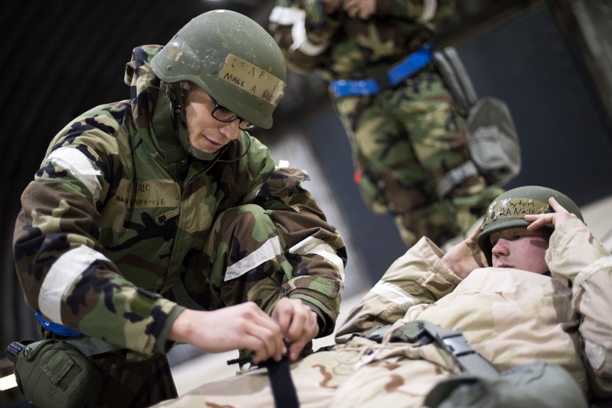 A Member of the 48th Fighter Wing practices self-aid and buddy care during an Ability to Survive and Operate exercise at Royal Air Force Lakenheath, England, Jan. 16. The exercise allowed the wing to identify strengths and weaknesses for future training and operational decisions. (U.S. Air Force photo/Senior Airman Malcolm Mayfield)