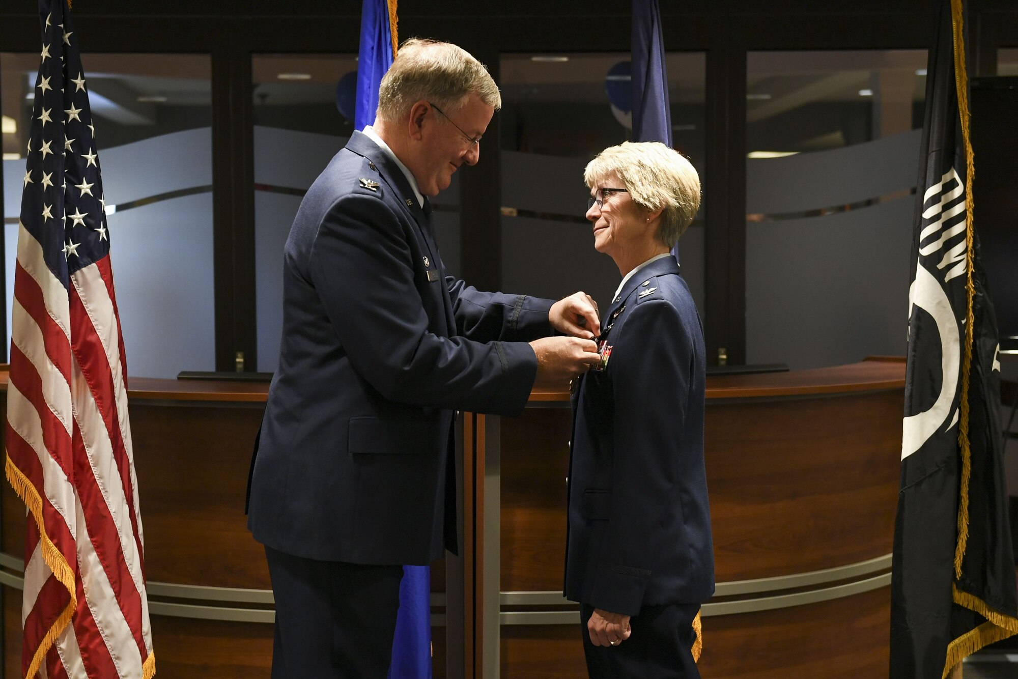 Col. Sharon Colaizzi, commander of the 911th Aeromedical Staging Squadron, receives the Legion of Merit medal from Col. Jeff VanDootingh, commander of the 911th Airlift Wing at the Pittsburgh International Airport Air Reserve Station, Pa., Jan. 6, 2018. Beyond one year spent at the Pentagon, from April 2012 to May 2013, as the Individual Mobilization Augmentee, Nurse to Medical Directorate, Headquarters, Air Force Reserve, Colaizzi served with the bulk of her career with the 911th AW. (U.S. Air Force photo by Senior Airman Beth Kobily)