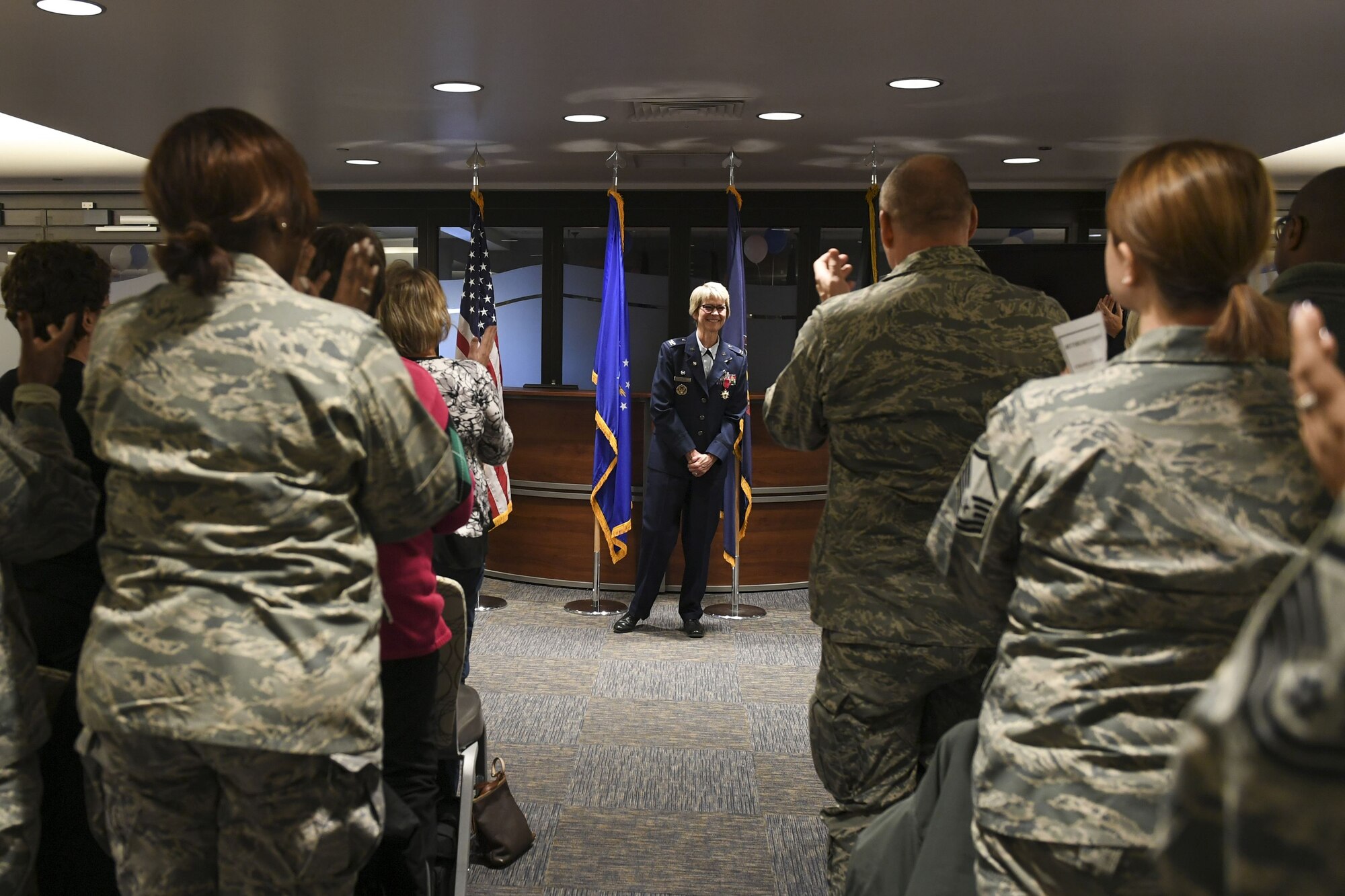 Friends, family and coworkers applaud Col. Sharon Colaizzi, commander of the 911th Aeromedical Staging Squadron, during her retirement ceremony at the Pittsburgh International Airport Air Reserve Station, Pa., Jan. 6, 2018. Colaizzi retired as the commander of the 911th Aeromedical Staging Squadron after 35 years of honorable service to the Air Force. (U.S. Air Force photo by Senior Airman Beth Kobily)