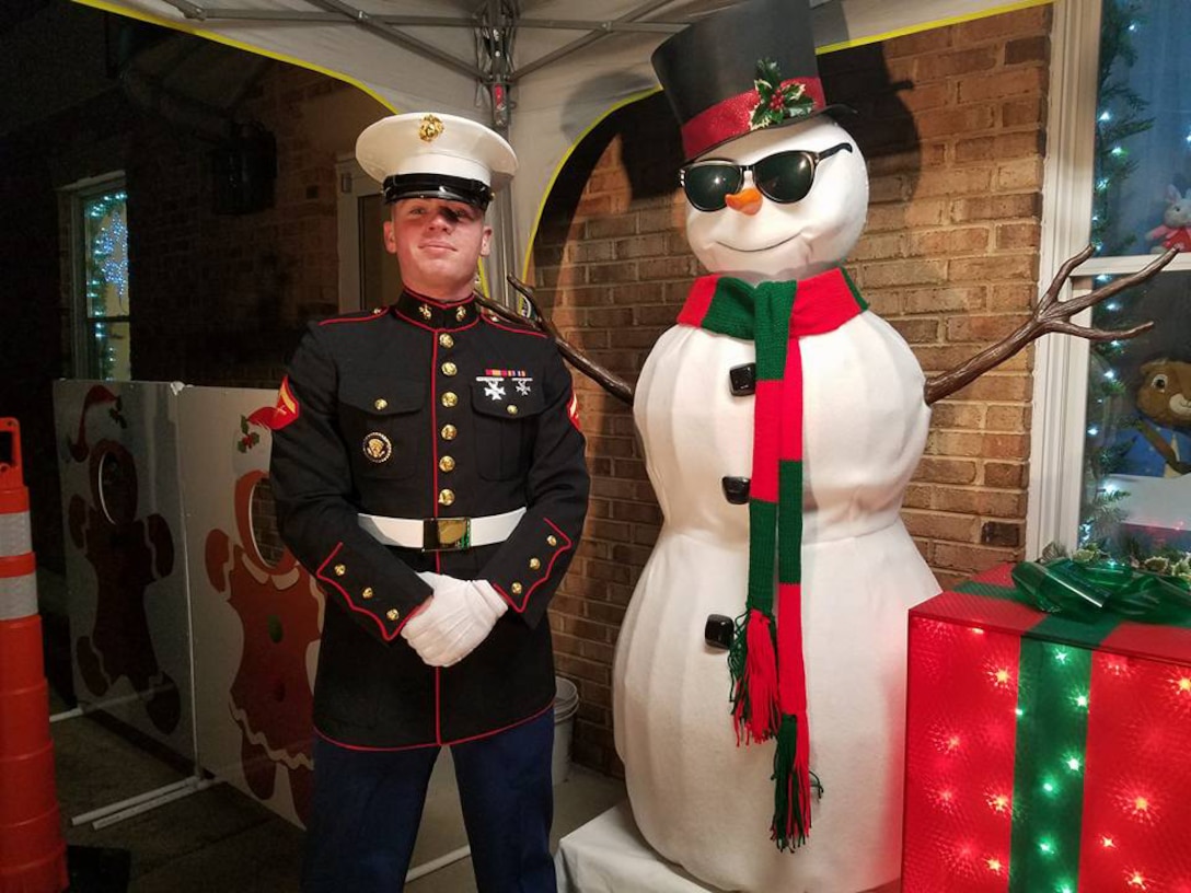 Lance Cpl. Jeffrey Lynch is shown supporting a Toys for Tots event at the Glancy Light Show.