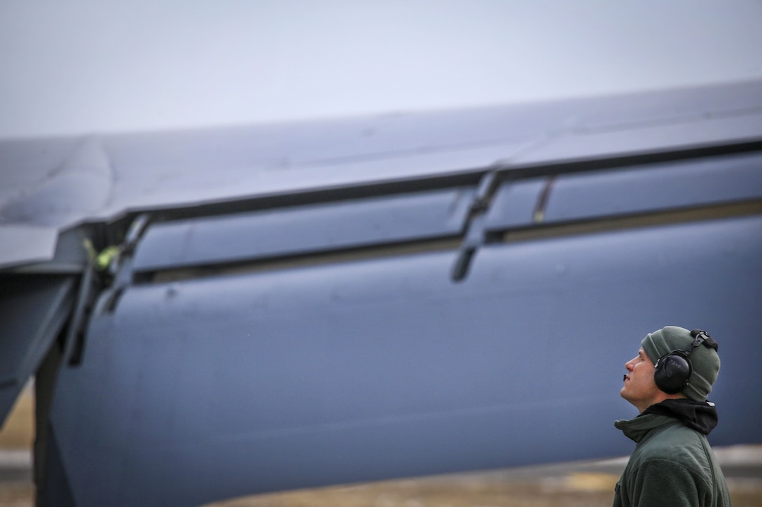 Staff Sgt. Robert Cento performs final pre-flight checks on a KC-135R Stratotanker before a training flight.