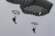 Members of the 820th Base Defense Group drift toward the ground after conducting a static-line jump from an HC-130J Combat King II, Jan. 17, 2018, at the Lee Fulp drop zone in Tifton, Ga. The 820th BDG routinely conducts static-line jumps to maintain qualifications and ensure mission readiness. (U.S. Air Force photo by Senior Airman Daniel Snider)