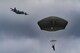 A member of the 820th Base Defense Group drifts toward the ground after conducting a static-line jump from an HC-130J Combat King II, Jan. 17, 2018, at the Lee Fulp drop zone in Tifton, Ga. The 820th BDG routinely conducts static-line jumps to maintain qualifications and ensure mission readiness. (U.S. Air Force photo by Senior Airman Daniel Snider)