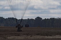 A member of the 820th Base Defense Group lands after a static-line parachute jump from an HC-130J Combat King II, Jan. 17, 2018, at the Lee Fulp drop zone in Tifton, Ga. The 820th BDG routinely conducts static-line jumps to maintain qualifications and ensure mission readiness. (U.S. Air Force photo by Senior Airman Daniel Snider)