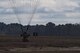 A member of the 820th Base Defense Group lands after a static-line parachute jump from an HC-130J Combat King II, Jan. 17, 2018, at the Lee Fulp drop zone in Tifton, Ga. The 820th BDG routinely conducts static-line jumps to maintain qualifications and ensure mission readiness. (U.S. Air Force photo by Senior Airman Daniel Snider)