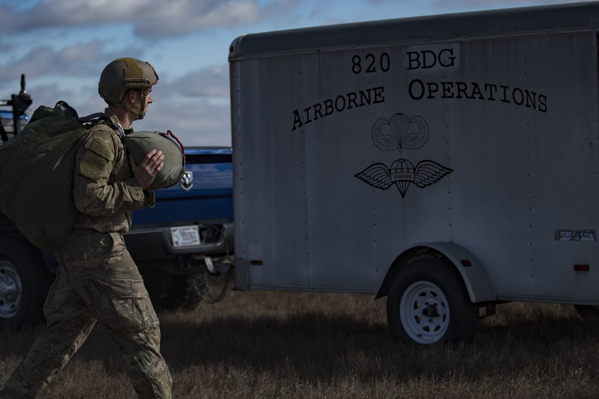 Staff Sgt. Richard Murkin, 823th Base Defense Squadron jumpmaster returns his equipment to the Aircrew Flight Equipment section after conducting a static-line jump from an HC-130J Combat King II, Jan. 17, 2018, at the Lee Fulp drop zone in Tifton, Ga. The 820th BDG routinely conducts static-line jumps to maintain qualifications and ensure mission readiness. (U.S. Air Force photo by Senior Airman Daniel Snider)