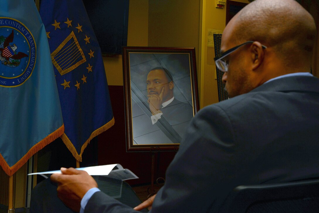 Makola Abdullah, president of Virginia State University, prepares for his speech during Defense Contract Management Agency’s Martin Luther King Day celebration at its Fort Lee, Virginia, headquarters Jan. 11. Abdullah and Virginia-born poet, author and educator Latorial Faison served as the event's special guests. (DCMA photo by Thomas Perry)