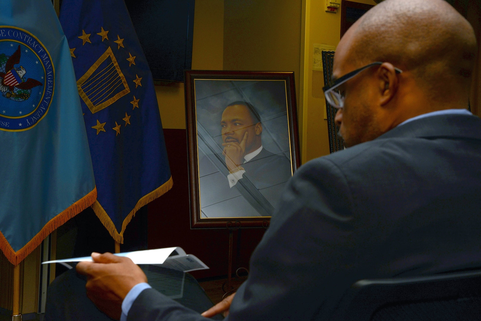 Makola Abdullah, president of Virginia State University, prepares for his speech during Defense Contract Management Agency’s Martin Luther King Day celebration at its Fort Lee, Virginia, headquarters Jan. 11. Abdullah and Virginia-born poet, author and educator Latorial Faison served as the event's special guests. (DCMA photo by Thomas Perry)