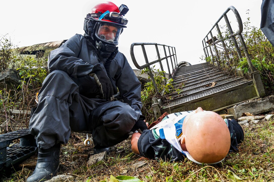 Sgt. Barbara Martinez provides medical aid to a dummy casualty.