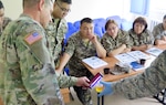 Kazak Soldiers learn to field test water samples for contamination during a subject matter expert exchange on “Operational Preventive Medicine in Support of Deploying Forces.”