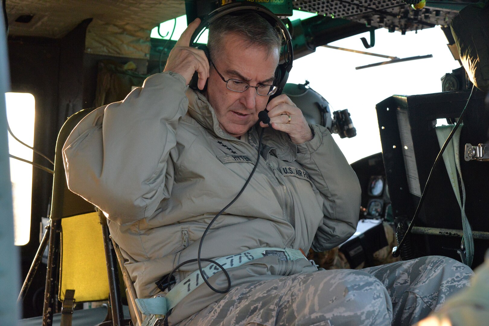 U.S. Air Force Gen. John Hyten, commander of U.S. Strategic Command (USSTRATCOM), checks his equipment before flying in a UH-1N Huey rotary aircraft at Malmstrom Air Force Base, Mont., Jan. 16, 2018.