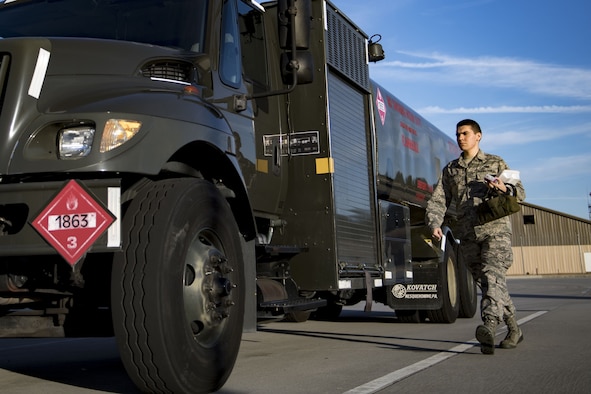 Airman 1st Class Evan Valance, 23d Logistics Readiness Squadron fuels distribution operator, carries gear and food to an M-11 refueling truck before conducting HH-60G Pave Hawk hot-pit refueling operations, Jan. 16, 2018 at Moody Air Force Base, Ga. Airmen who work in the petroleum, oils and lubricants (POL) flight frequently use hot pit refueling, which is a more efficient tactic that allows aircrews a quick transition from the flight line back to their current objective. (U.S. Air Force photo by Senior Airman Daniel Snider)