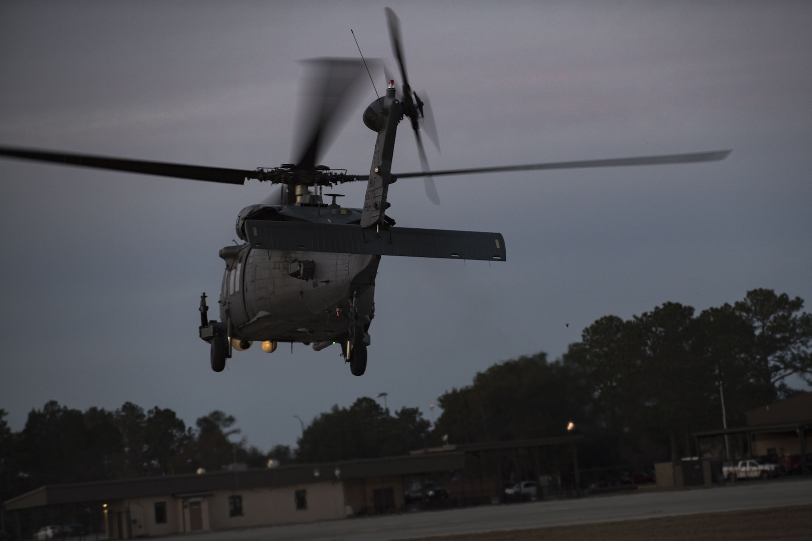 An HH-60G Pave Hawk departs from a hot-pit refueling point, Jan. 16, 2018 at Moody Air Force Base, Ga. Airmen who work in the petroleum, oils and lubricants (POL) flight frequently use hot pit refueling, which is a more efficient tactic that allows aircrews a quick transition from the flight line back to their current objective. (U.S. Air Force photo by Senior Airman Daniel Snider)