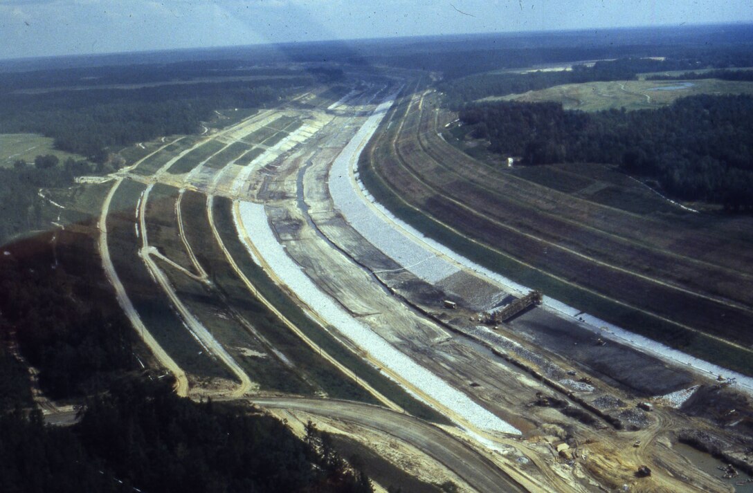 The U.S. Army Corps of Engineers Nashville District constructs the northern stretch of the Tennessee-Tombigbee Waterway in Mississippi Sept. 12, 1981.  The Mobile District and Nashville District, 125 prime contractors and 1,200 subcontractors worked on the overall waterway. The 10 locks and five dams required a total of 2.2 million cubic yards of concrete and 33,000 tons of reinforcing steel. The project, dedicated in 1985, is the largest civil works project ever constructed in the United States. (USACE Photo)