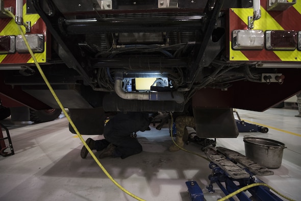 Firetruck and Refueling Maintenance specialists work on a 27th Special Operations Logistics Readiness Squadron vehicle at Cannon Air Force Base, New Mexico, Jan. 16, 2018. Airmen in this career field are the only ones Air Force-wide that are required to be able to operate on all government vehicles on their respective bases. (U.S. Air Force photo by Senior Airman Lane T. Plummer)