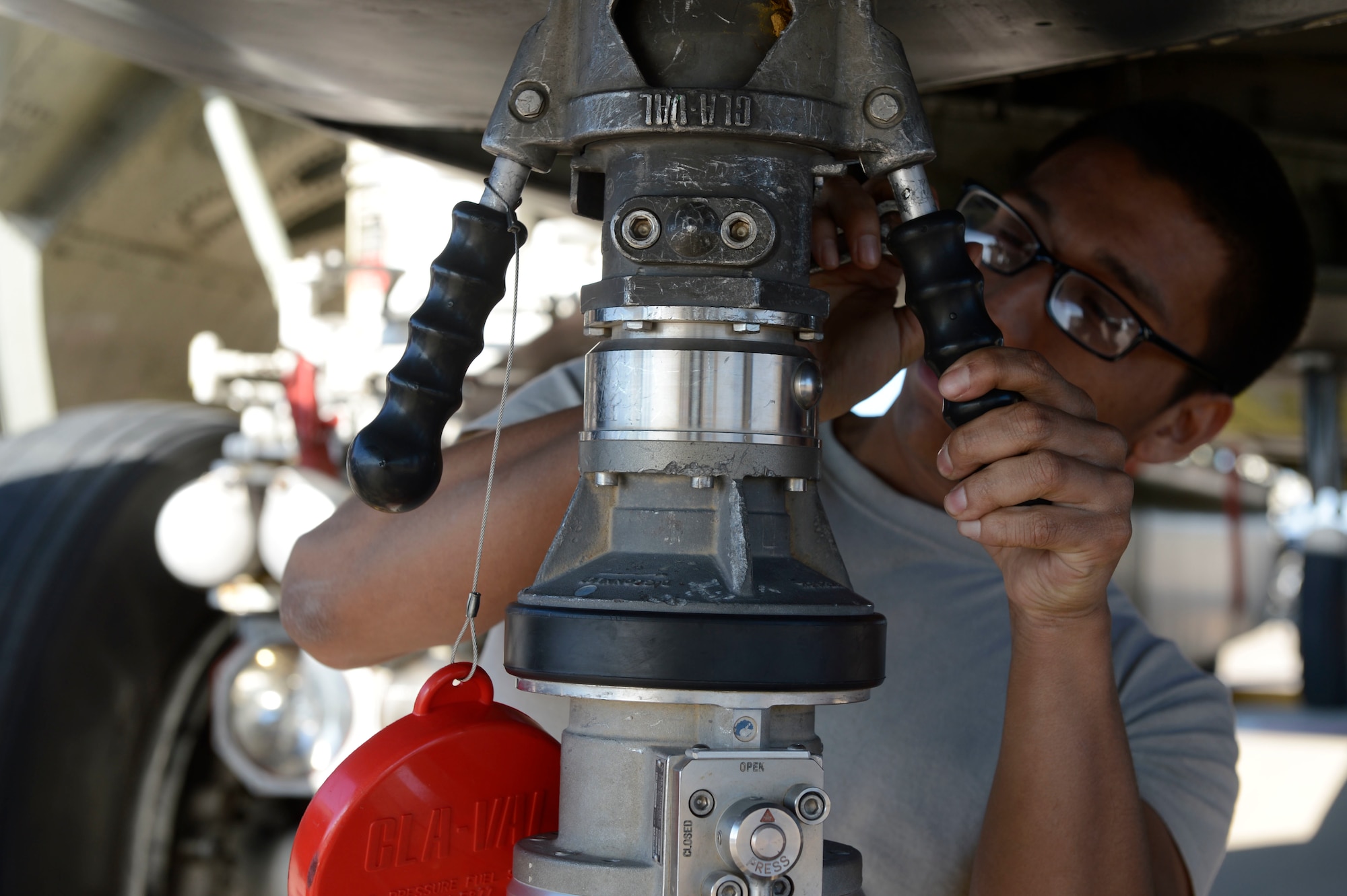 Senior Airman Aaron Sampayan, assigned to the 23rd Expeditionary Bomb Squadron, connects a refueling hose to a B-52 Stratofortress, at Morón Air Base, Spain, Jan. 16, 2018. Through U.S. and Spanish cooperation, Morón Air Base has a long history of supporting bomber operations and serving the strategic deterrence requirements of U.S. and NATO allies for decades. (U.S. Air Force photo by Senior Airman Natalie Plas)