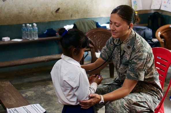 Maj. Linda Jones, U.S. Air Force Pediatric Medical Director with the 628th Medical Operations Squadron works with a patient in Nepal in July 2017. Jones is just one of the International Health Specialists (IHSs) supporting U.S. Pacific Command’s (PACAF) capacity-building efforts by providing medical, dental, optometry, and engineering assistance to their citizens. (U.S. Air Force photo)