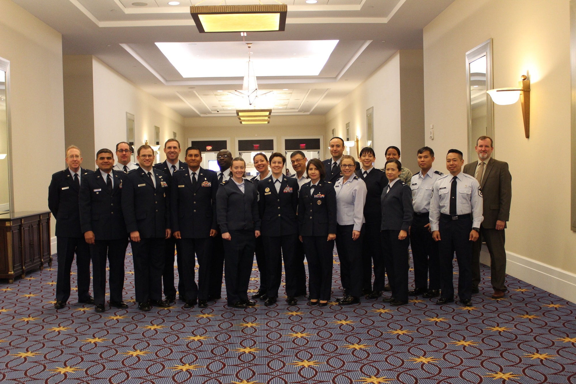 A group of U.S. Air Force Medical International Health Specialists (IHSs) pose for a group photo at the 2017 Association of Military Surgeons of the United States (AMSUS) conference, Nov 30, 2017. IHSs are made up of health care professionals who bring their diverse intercultural, medical, and military operations experiences together to build partnership capabilities in allied countries. (U.S. Air Force photo by Karina Luis)