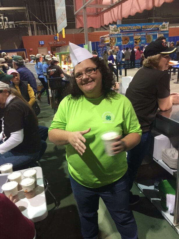 Janet Swisher, management analyst with DLA Distribution volunteers to hand out milk shake’s during the 102nd Pennsylvania Farm Show on Jan. 10.