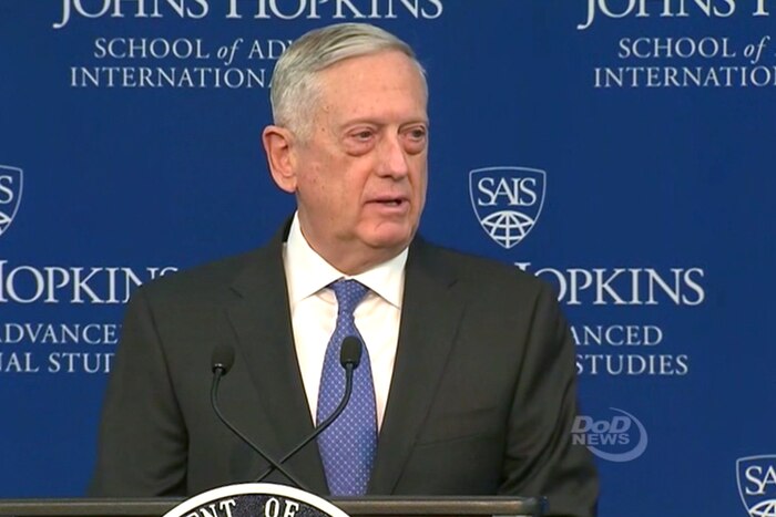 The Defense Secretary James N. Mattis speaks from behind a podium.
