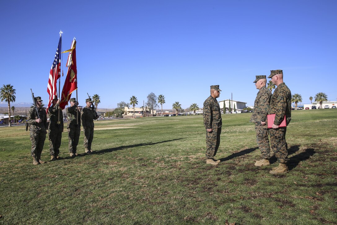 Sgt. Maj. Michael E. Cedeno, off going sergeant major, 1st Battalion, 7th Marine Regiment, Marine Corps Air Ground Combat Center Twentynine Palms, Calif., waits to be awarded the meritorious service medal for his outstanding service for 1/7 during the post and relief ceremony at the commanding general’s lawn aboard the Combat Center Jan. 11, 2018. During the ceremony Cedeno relinquished his post as sergeant major to Sgt. Maj. Brian E. Anderson, incoming sergeant major, 1/7, MCAGCC . (Official Marine Corps photo by Lance Cpl. Margaret Gale)
