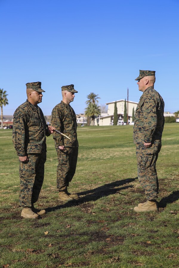Sgt. Maj. Michael E. Cedeno, off going sergeant major, 1st Battalion, 7th Marine Regiment, Marine Corps Air Ground Combat Center Twentynine Palms, Calif.,  prepares to hand over the Mameluke sword as he relinquishes his post at the commanding general’s lawn aboard the Combat Center Jan. 11, 2018.  During the ceremony Cedeno relinquished his post as sergeant major to Sgt. Maj. Brian E. Anderson, incoming sergeant major, 1/7, MCGACC. (Official Marine Corps photo by Lance Cpl. Margaret Gale)