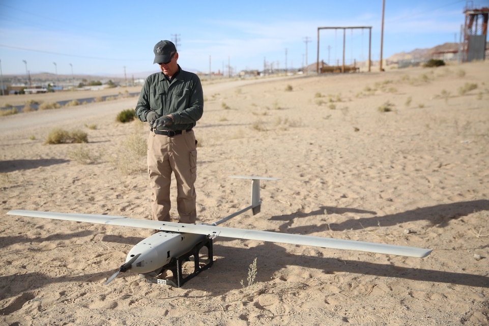 Daniel Lloyd, Lockheed Martin Skunk Works, prepares the unmanned air system Stalker XE for a flight during exercise Steel Knight aboard Marine Corps Air Ground Combat Center Twentynine Palms, Calif., Nov.28, 2017. The Combat Center invited Lockheed Martin to participate in exercise Steel Knight to develop teaming tactics, techniques and procedures with manned and unmanned air systems.(Marine Corps photo by Cpl. Devin Andrews)