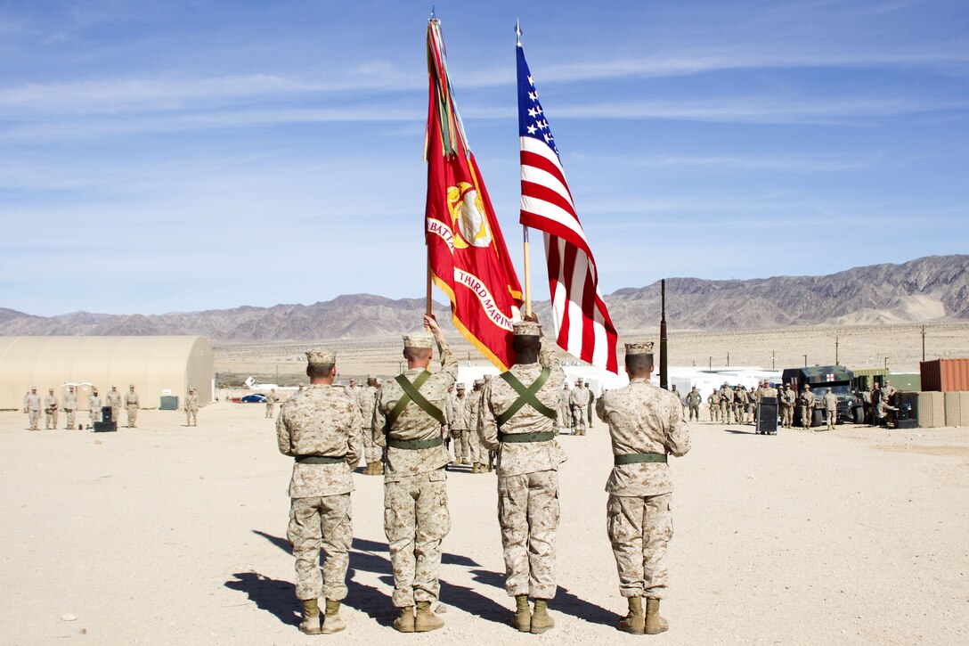 Color guard stands in post and relief ceremony at Camp Wilson aboard Marine Corps Air Ground Combat Center, Twentynine Palms, Calif., Jan. 17, 2018. The post and relief ceremony took place during an integrated training exercise that 3rd Marine Division took part in. (U.S. Marine Corps photo by Pfc. Rachel K. Porter)