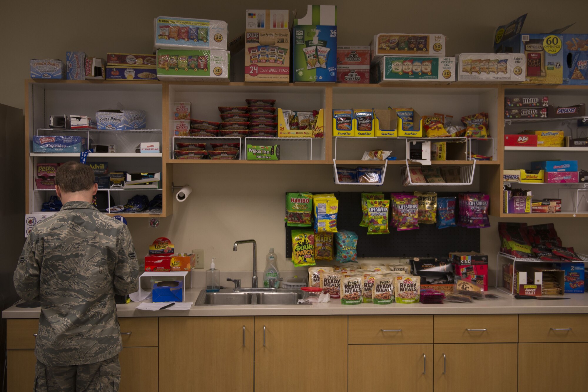 A 62nd Aircraft Maintenance Unit member prepares his lunch in front of the AMU snackbar Jan. 18, 2018, at Luke Air Force Base. Deb Robinson, the base dietician, is leading an initiative to change snackbars to offer healtheir options in an effort to improve the fitness and physical efficiency of Luke's Airmen. (U.S. Air Force photo/Senior Airman Ridge Shan)